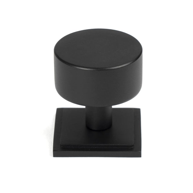This is an image showing From The Anvil - Matt Black Kelso Cabinet Knob - 32mm (Square) available from trade door handles, quick delivery and discounted prices