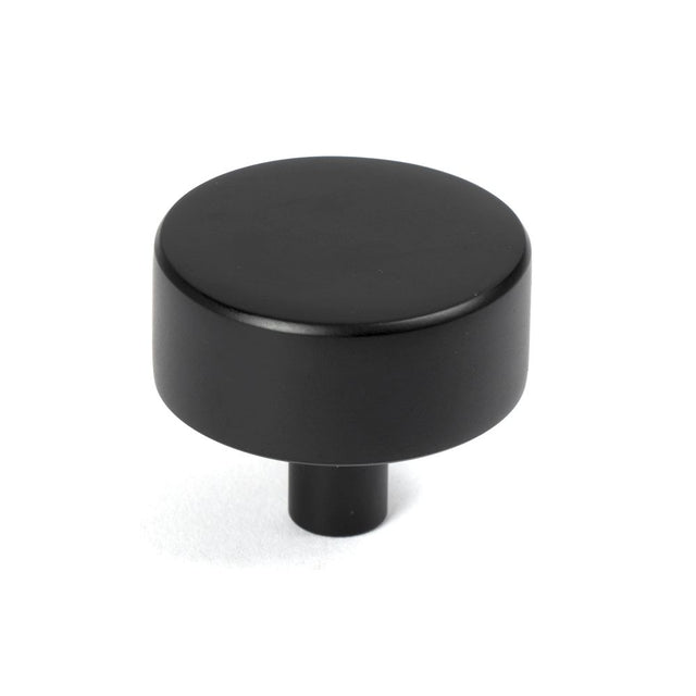 This is an image showing From The Anvil - Matt Black Kelso Cabinet Knob - 38mm (No rose) available from trade door handles, quick delivery and discounted prices