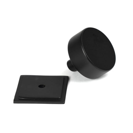 This is an image showing From The Anvil - Matt Black Kelso Cabinet Knob - 38mm (Square) available from trade door handles, quick delivery and discounted prices