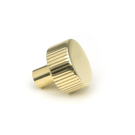 This is an image showing From The Anvil - Polished Brass Judd Cabinet Knob - 25mm (No Rose) available from trade door handles, quick delivery and discounted prices