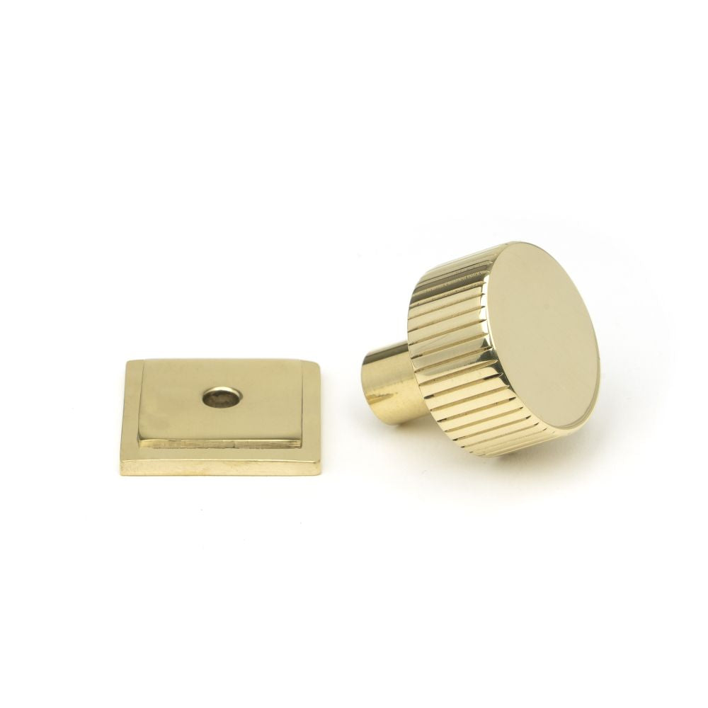 This is an image showing From The Anvil - Polished Brass Judd Cabinet Knob - 25mm (Square) available from trade door handles, quick delivery and discounted prices