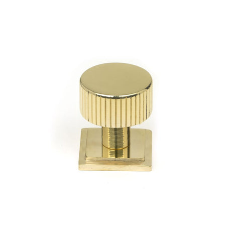 This is an image showing From The Anvil - Polished Brass Judd Cabinet Knob - 25mm (Square) available from trade door handles, quick delivery and discounted prices