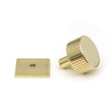This is an image showing From The Anvil - Polished Brass Judd Cabinet Knob - 32mm (Square) available from trade door handles, quick delivery and discounted prices