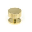 This is an image showing From The Anvil - Polished Brass Judd Cabinet Knob - 38mm (Plain) available from trade door handles, quick delivery and discounted prices