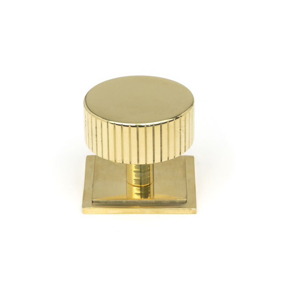 This is an image showing From The Anvil - Polished Brass Judd Cabinet Knob - 38mm (Square) available from trade door handles, quick delivery and discounted prices