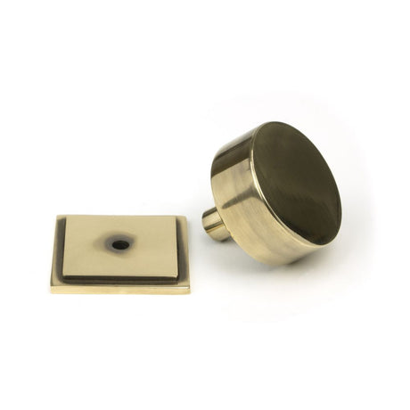 This is an image showing From The Anvil - Aged Brass Kelso Cabinet Knob - 38mm (Square) available from trade door handles, quick delivery and discounted prices