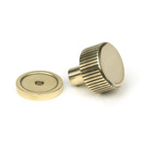 This is an image showing From The Anvil - Aged Brass Judd Cabinet Knob - 25mm (Plain) available from trade door handles, quick delivery and discounted prices