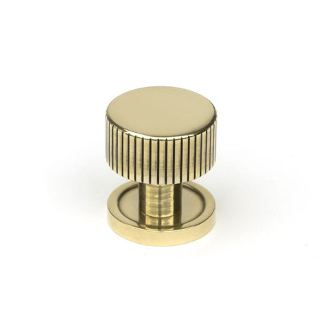 This is an image showing From The Anvil - Aged Brass Judd Cabinet Knob - 25mm (Plain) available from trade door handles, quick delivery and discounted prices