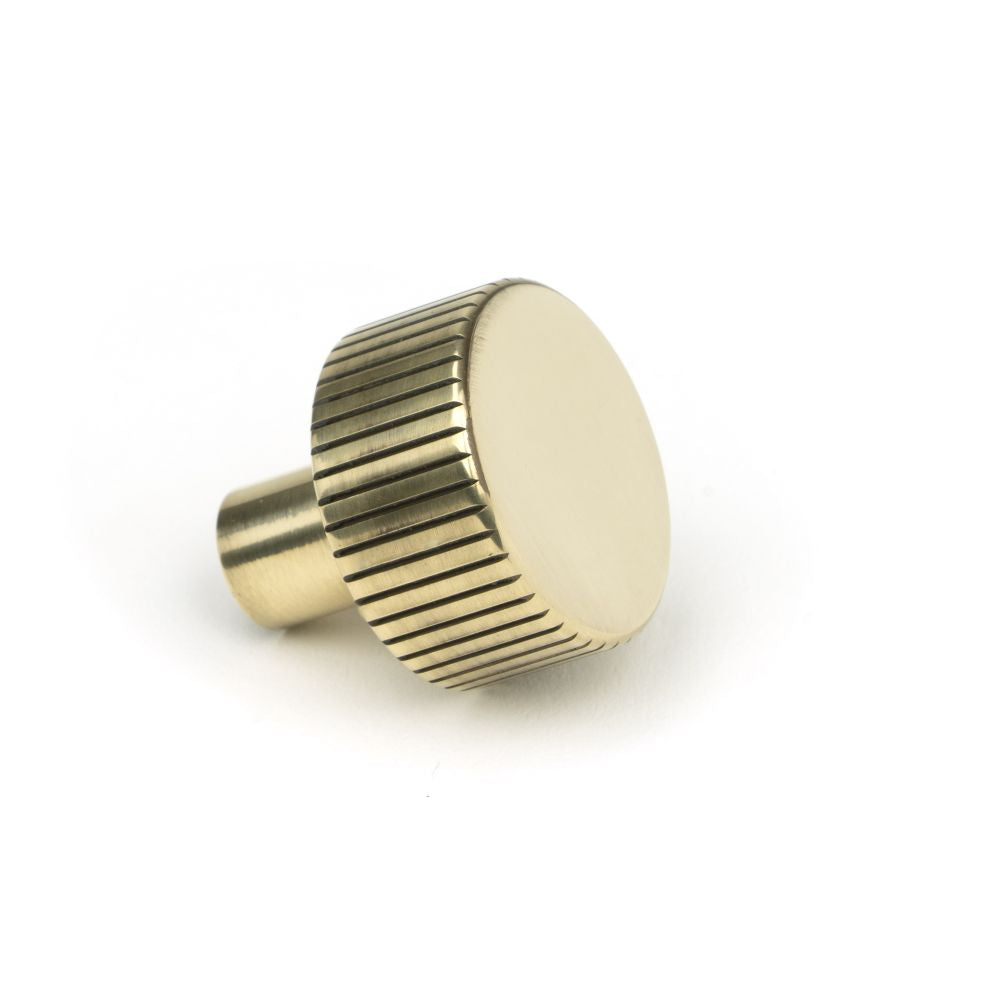 This is an image showing From The Anvil - Aged Brass Judd Cabinet Knob - 25mm (No rose) available from trade door handles, quick delivery and discounted prices