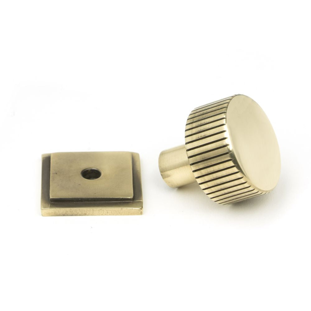 This is an image showing From The Anvil - Aged Brass Judd Cabinet Knob - 25mm (Square) available from trade door handles, quick delivery and discounted prices