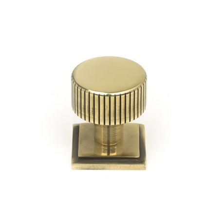 This is an image showing From The Anvil - Aged Brass Judd Cabinet Knob - 25mm (Square) available from trade door handles, quick delivery and discounted prices