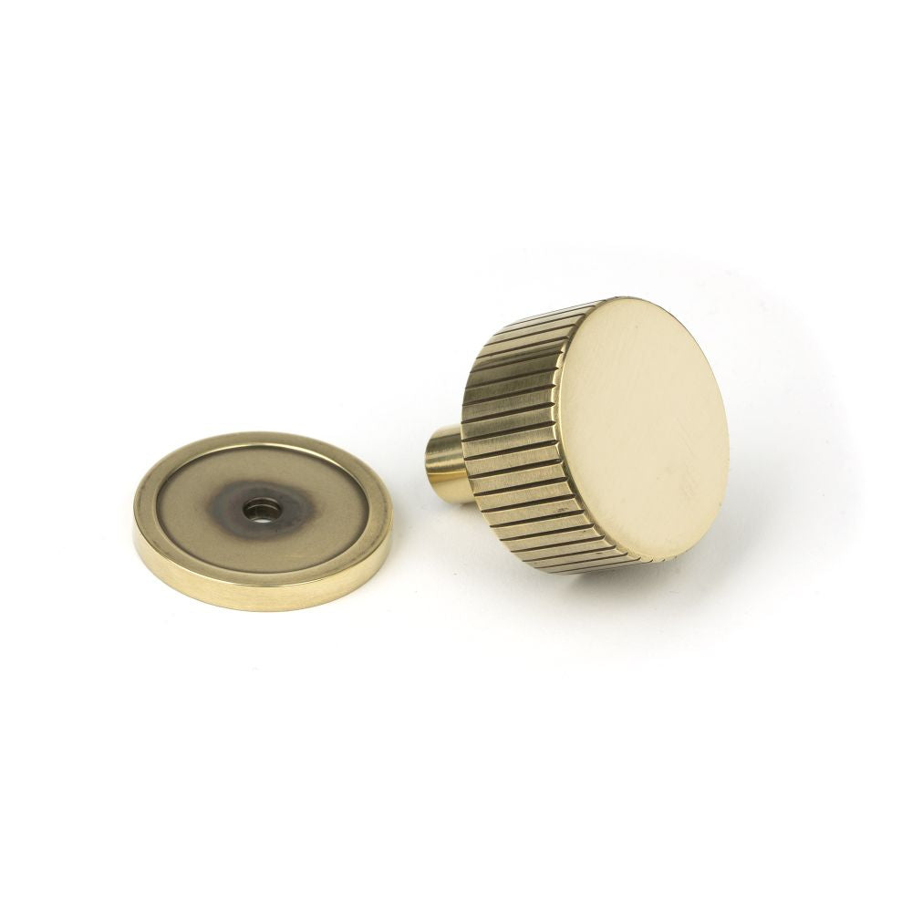 This is an image showing From The Anvil - Aged Brass Judd Cabinet Knob - 32mm (Plain) available from trade door handles, quick delivery and discounted prices