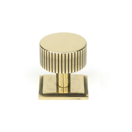 This is an image showing From The Anvil - Aged Brass Judd Cabinet Knob - 32mm (Square) available from trade door handles, quick delivery and discounted prices