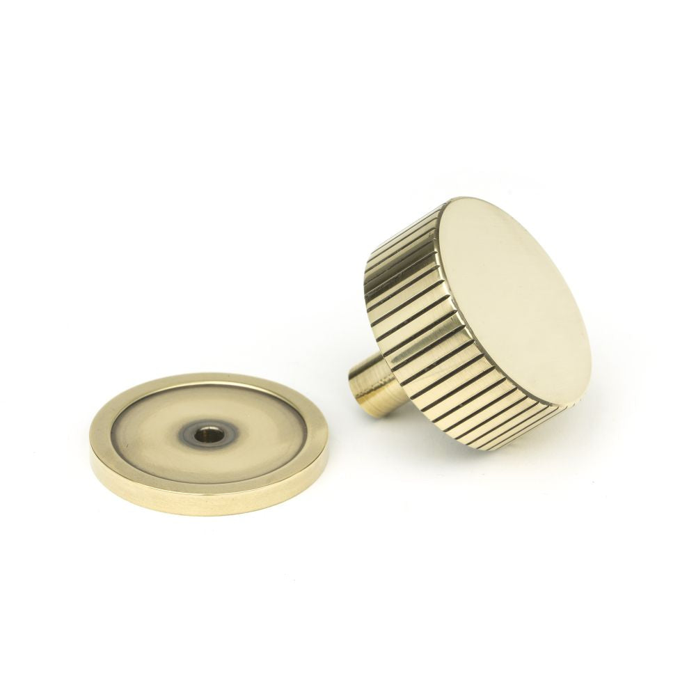 This is an image showing From The Anvil - Aged Brass Judd Cabinet Knob - 38mm (Plain) available from trade door handles, quick delivery and discounted prices