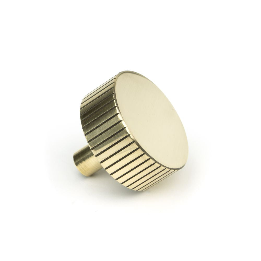 This is an image showing From The Anvil - Aged Brass Judd Cabinet Knob - 38mm (No rose) available from trade door handles, quick delivery and discounted prices