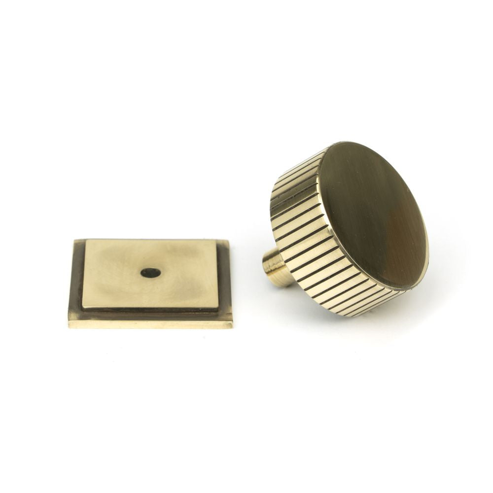 This is an image showing From The Anvil - Aged Brass Judd Cabinet Knob - 38mm (Square) available from trade door handles, quick delivery and discounted prices