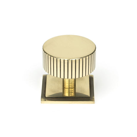 This is an image showing From The Anvil - Aged Brass Judd Cabinet Knob - 38mm (Square) available from trade door handles, quick delivery and discounted prices