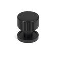This is an image showing From The Anvil - Matt Black Judd Cabinet Knob - 25mm (Plain) available from trade door handles, quick delivery and discounted prices