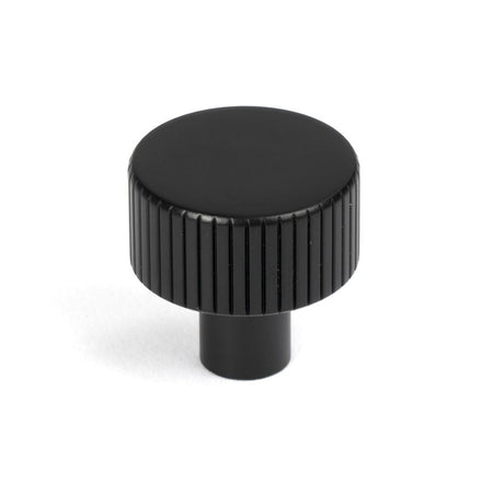 This is an image showing From The Anvil - Matt Black Judd Cabinet Knob - 25mm (No rose) available from trade door handles, quick delivery and discounted prices