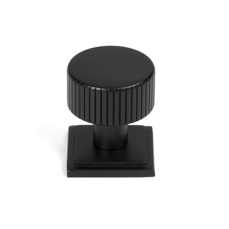 This is an image showing From The Anvil - Matt Black Judd Cabinet Knob - 25mm (Square) available from trade door handles, quick delivery and discounted prices