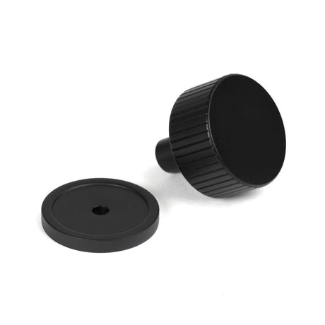 This is an image showing From The Anvil - Matt Black Judd Cabinet Knob - 32mm (Plain) available from trade door handles, quick delivery and discounted prices