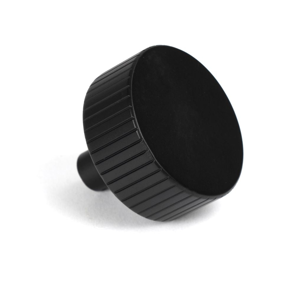 This is an image showing From The Anvil - Matt Black Judd Cabinet Knob - 38mm (No rose) available from trade door handles, quick delivery and discounted prices