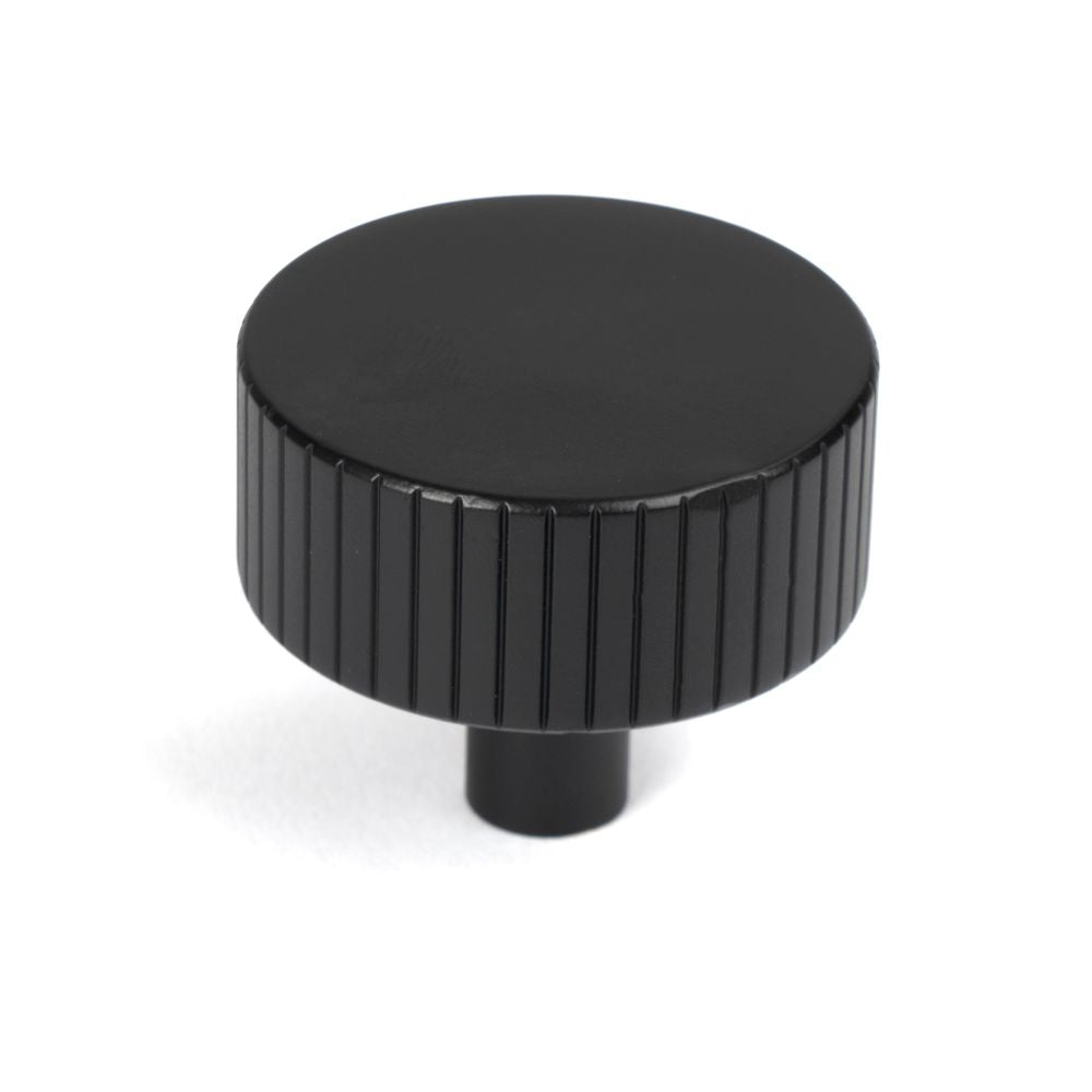 This is an image showing From The Anvil - Matt Black Judd Cabinet Knob - 38mm (No rose) available from trade door handles, quick delivery and discounted prices