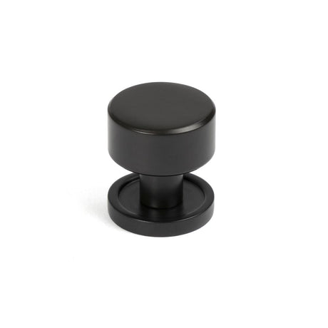 This is an image showing From The Anvil - Aged Bronze Kelso Cabinet Knob - 25mm (Plain) available from trade door handles, quick delivery and discounted prices