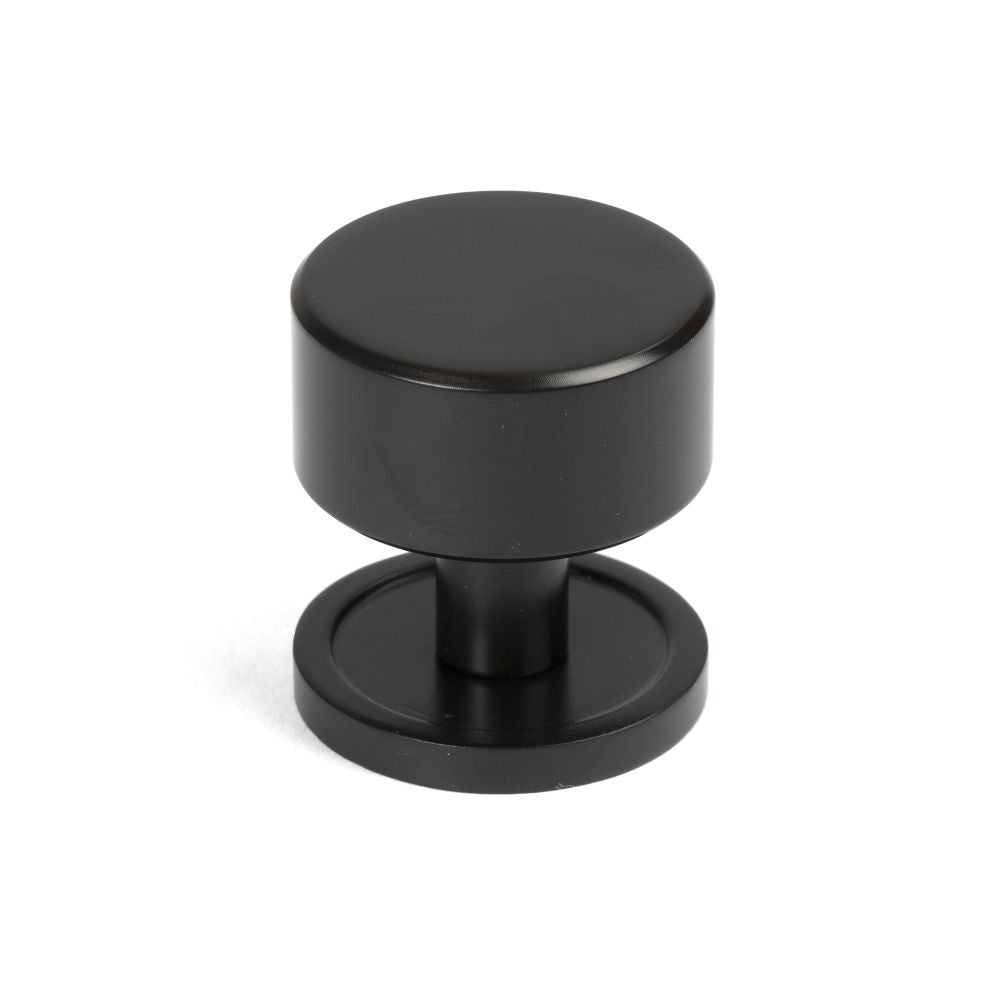 This is an image showing From The Anvil - Aged Bronze Kelso Cabinet Knob - 32mm (Plain) available from trade door handles, quick delivery and discounted prices