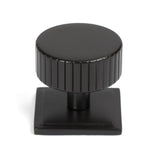 This is an image showing From The Anvil - Aged Bronze Judd Cabinet Knob - 38mm (Square) available from trade door handles, quick delivery and discounted prices