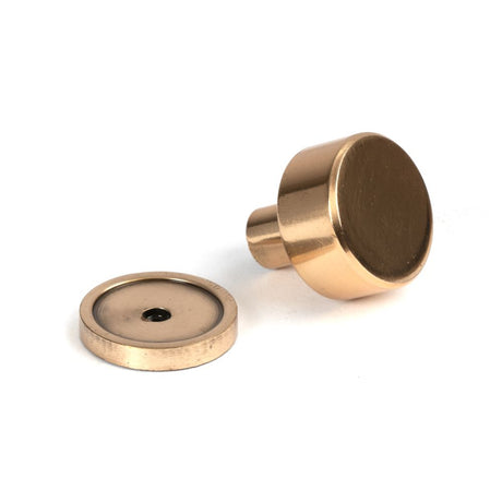 This is an image showing From The Anvil - Polished Bronze Kelso Cabinet Knob - 25mm (Plain) available from trade door handles, quick delivery and discounted prices