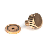 This is an image showing From The Anvil - Polished Bronze Judd Cabinet Knob - 25mm (Plain) available from trade door handles, quick delivery and discounted prices