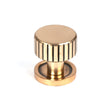 This is an image showing From The Anvil - Polished Bronze Judd Cabinet Knob - 25mm (Plain) available from trade door handles, quick delivery and discounted prices