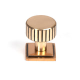 This is an image showing From The Anvil - Polished Bronze Judd Cabinet Knob - 25mm (Square) available from trade door handles, quick delivery and discounted prices