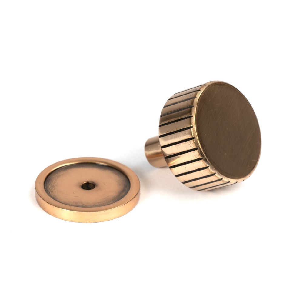 This is an image showing From The Anvil - Polished Bronze Judd Cabinet Knob - 32mm (Plain) available from trade door handles, quick delivery and discounted prices