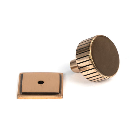 This is an image showing From The Anvil - Polished Bronze Judd Cabinet Knob - 32mm (Square) available from trade door handles, quick delivery and discounted prices