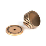 This is an image showing From The Anvil - Polished Bronze Judd Cabinet Knob - 38mm (Plain) available from trade door handles, quick delivery and discounted prices