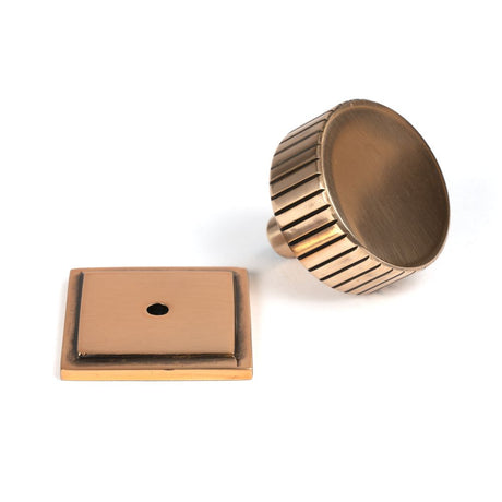 This is an image showing From The Anvil - Polished Bronze Judd Cabinet Knob - 38mm (Square) available from trade door handles, quick delivery and discounted prices