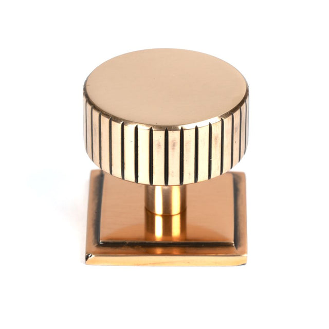 This is an image showing From The Anvil - Polished Bronze Judd Cabinet Knob - 38mm (Square) available from trade door handles, quick delivery and discounted prices