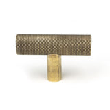 This is an image showing From The Anvil - Aged Brass Brompton T-Bar available from trade door handles, quick delivery and discounted prices