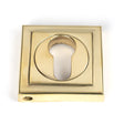 This is an image showing From The Anvil - Polished Brass Round Euro Escutcheon (Square) available from trade door handles, quick delivery and discounted prices