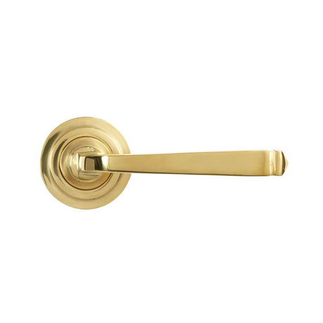 This is an image showing From The Anvil - Polished Brass Avon Round Lever on Rose Set (Art Deco) - Unspru available from trade door handles, quick delivery and discounted prices