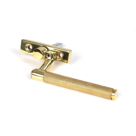 This is an image showing From The Anvil - Polished Brass Brompton Espag - LH available from trade door handles, quick delivery and discounted prices