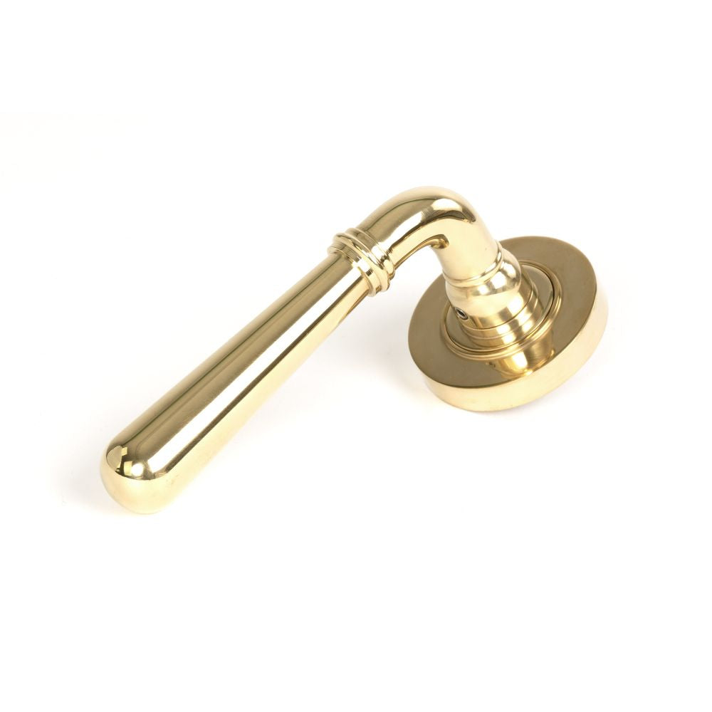 This is an image showing From The Anvil - Polished Brass Newbury Lever on Rose Set (Plain) available from trade door handles, quick delivery and discounted prices