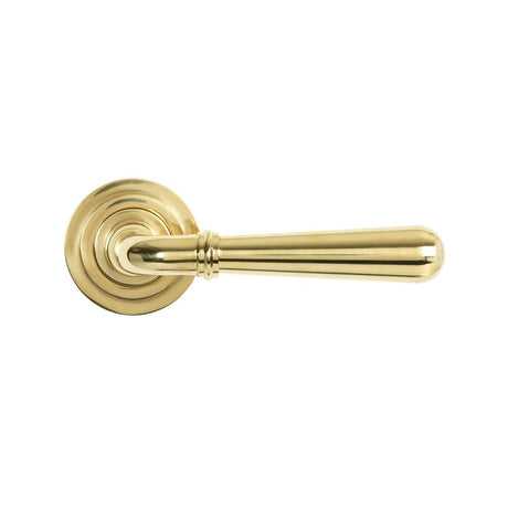 This is an image showing From The Anvil - Polished Brass Newbury Lever on Rose Set (Art Deco) - Unsprung available from trade door handles, quick delivery and discounted prices