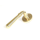 This is an image showing From The Anvil - Polished Brass Newbury Lever on Rose Set (Art Deco) - Unsprung available from trade door handles, quick delivery and discounted prices