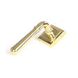 This is an image showing From The Anvil - Polished Brass Newbury Lever on Rose Set (Square) available from trade door handles, quick delivery and discounted prices