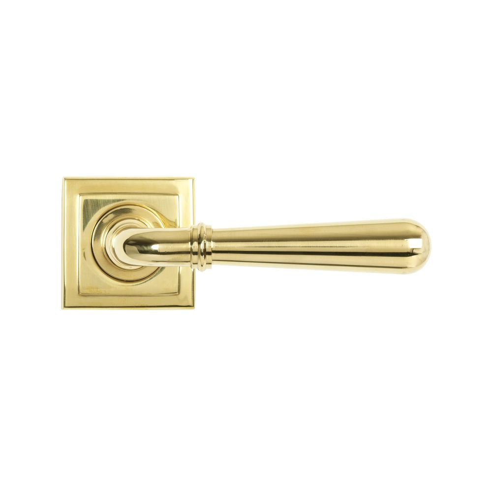 This is an image showing From The Anvil - Polished Brass Newbury Lever on Rose Set (Square) - Unsprung available from trade door handles, quick delivery and discounted prices