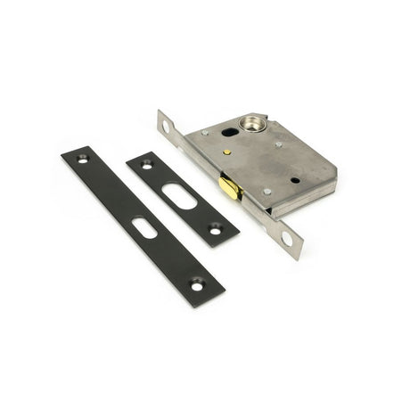 This is an image showing From The Anvil - Aged Bronze 50mm Sliding Door Lock available from trade door handles, quick delivery and discounted prices
