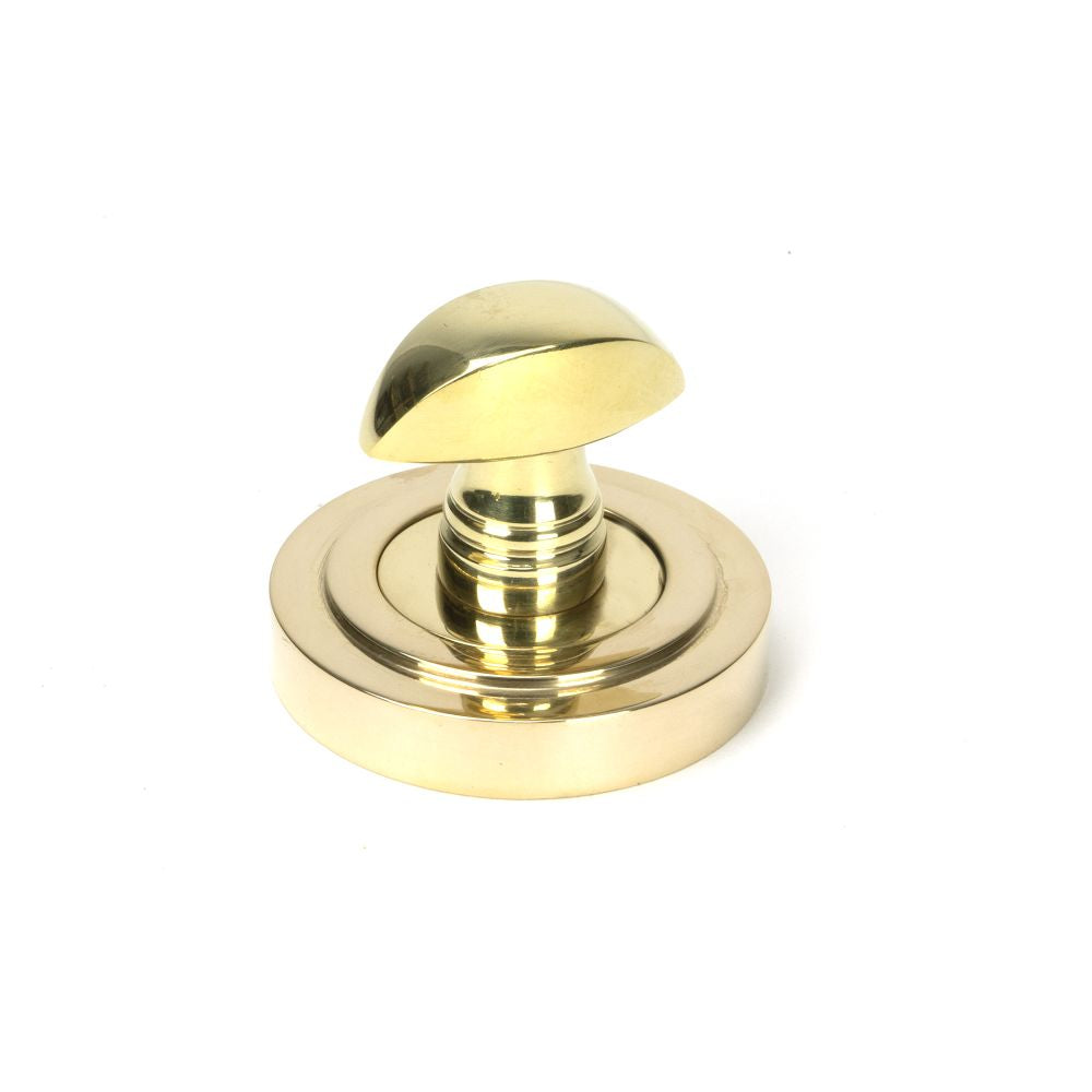 This is an image showing From The Anvil - Polished Brass Round Thumbturn Set (Art Deco) available from trade door handles, quick delivery and discounted prices